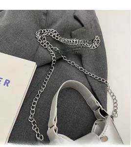 Close-up of elegant silver leather handbag featuring a sleek hardware metal chain strap