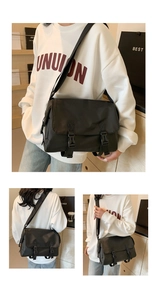 Detail view of black nylon messenger bag with double plastic buckles and wide shoulder strap