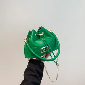 Fashionable green bucket bag with drawstring closure and gold geometric buckle hardware