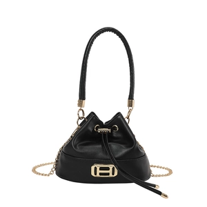 Minimalist black bucket bag with gold H buckle and chain strap shown on white background