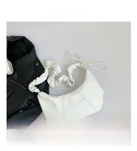 Detail of white PU leather hobo bag with unique ruched shoulder strap design