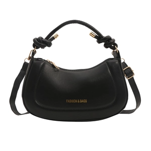 Minimalist black leather half-moon hobo bag with gold hardware and knotted strap detail