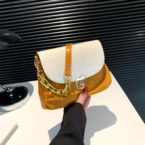 Chic patchwork shoulder bag with cream crocodile texture and yellow suede finish