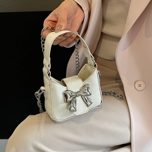 Mini white leather handbag with silver metallic bow detail and detachable chain strap