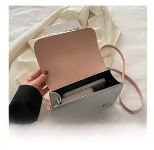Interior view of the silver PU leather crossbody bag showing space for a smartphone