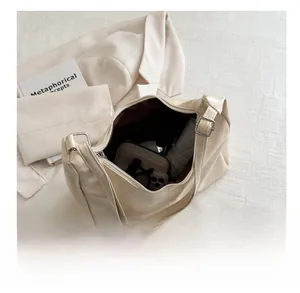 Interior view of large beige tote bag showing spacious capacity for daily essentials