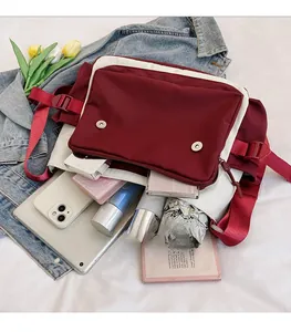 Interior detail of large canvas messenger bag showing high capacity for tablets and daily items