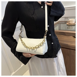 White faux leather baguette bag with a chunky gold chain strap and smooth zipper detail