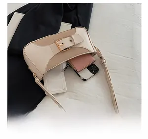 Detail view showing interior capacity of beige PU leather shoulder bag for daily essentials