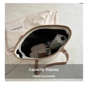 Top view of cream tote bag interior showing spacious capacity for phone and essentials