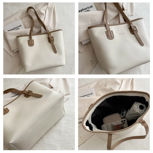 Macro view of interior storage capacity for umbrellas and wallets in a large beige tote bag