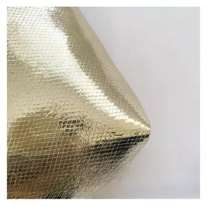 Close-up of golden metallic snake texture on large capacity cosmetic bag material