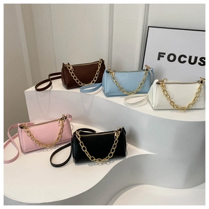 Detailed view of fashion baguette bags in five colors with chunky gold chain straps