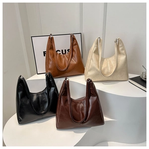 Detail of four versatile matte PU leather tote bags in caramel, cream, coffee, and black