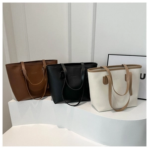 Three minimalist large capacity tote bags in dark brown, black, and beige PU leather