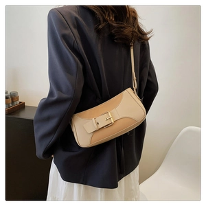 Chic two-tone shoulder bag in beige and apricot with decorative gold buckle styling