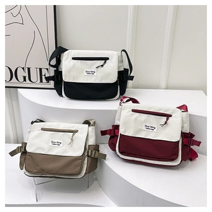 Detailed comparison of multi-color canvas messenger bags in black, khaki, and burgundy
