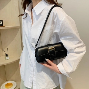 Classic black leather underarm bag for women with a vintage golden buckle and shoulder strap