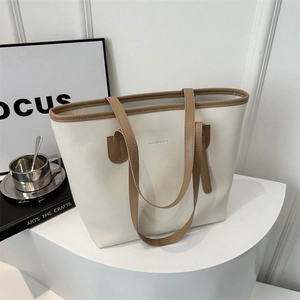 Minimalist beige and brown faux leather tote bag with Fashion & Bag text on display