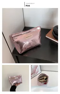 Detail view of pink metallic cosmetic bag with large capacity and zip closure