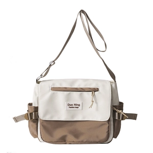 Minimalist canvas messenger bag with color-block flap and adjustable strap for students