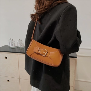 Minimalist caramel brown underarm bag with leather strap buckle for women
