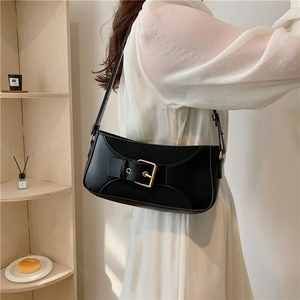 Minimalist black faux leather baguette shoulder bag with gold buckle for women