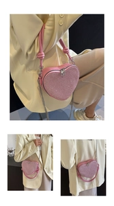 Detail of pink heart-shaped sequin handbag with chain strap and leather handle