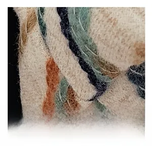 Detailed macro view of the knitted tweed fabric texture with multi-colored yarn patterns