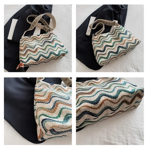 Detail of a wavy knit tote bag featuring a colorful crochet pattern and jacquard strap