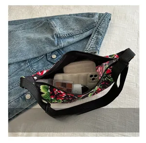 Interior view of floral crossbody bag showing spacious capacity for phone and wallet