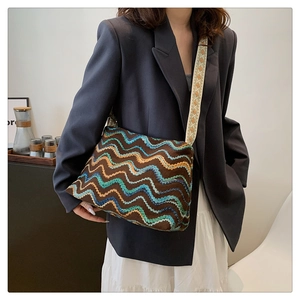 Detail of bohemian tote bag with colorful zigzag embroidery and wide ethnic shoulder strap