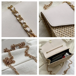 Close-up of the straw woven crossbody bag showing chain strap and internal storage