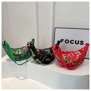 Detailed view of three half-moon crossbody bags with traditional Chinese floral patterns