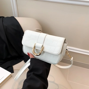 White faux leather crossbody bag with crocodile texture and gold U-shaped buckle