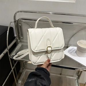 Minimalist white PU leather crossbody bag with V-quilted pattern and bronze buckle