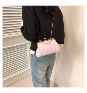 Close-up of pink marble pattern shell bag with gold metal frame and chain strap