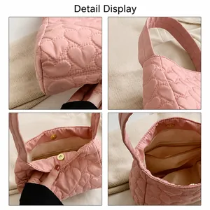 Detail showing pink heart quilted tote with magnetic closure and inner zipper pocket