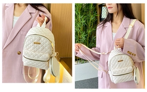 Detailed view of white quilted oxford cloth mini backpack with matching round coin pouch