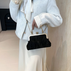 Elegant black velvet handbag with gold metal clasp and chain strap for women
