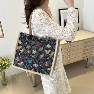 Retro canvas tote bag with colorful butterfly pattern and natural jute handles for daily commute
