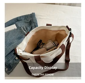 Interior view of the canvas tote bag showing its large capacity for daily essentials