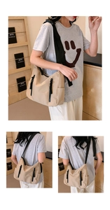 Détail du sac fourre-tout en nylon kaki avec fermetures éclair noires et tirettes tissées