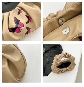 Detailed views of beige ruched cloud bag featuring butterfly prints and magnetic closure
