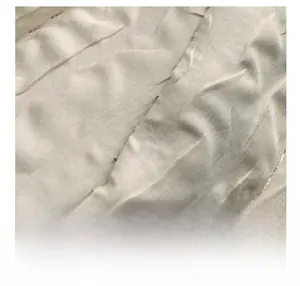 Detail shot of the cream-colored textured pleated fabric on the minimalist chest bag