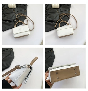 Vue détaillée du sac bicolore avec texture litchi et pieds de protection en métal