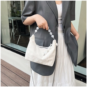 Chic white pleated crossbody bag with elegant bead handle and metal chain strap detail