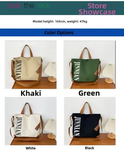 Détail de quatre couleurs de sacs cabas en toile avec logo JINNIAN imprimé