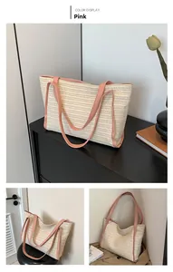 Close-up of pink leather handles and woven texture on a large capacity summer beach tote