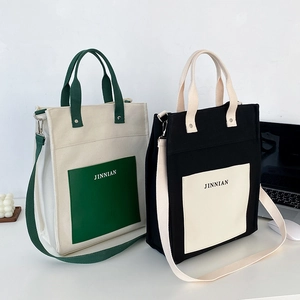 Large capacity canvas tote bag with contrast stitching and adjustable shoulder strap